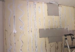 Scrape and prime glue Drywall repair and wallpaper removal